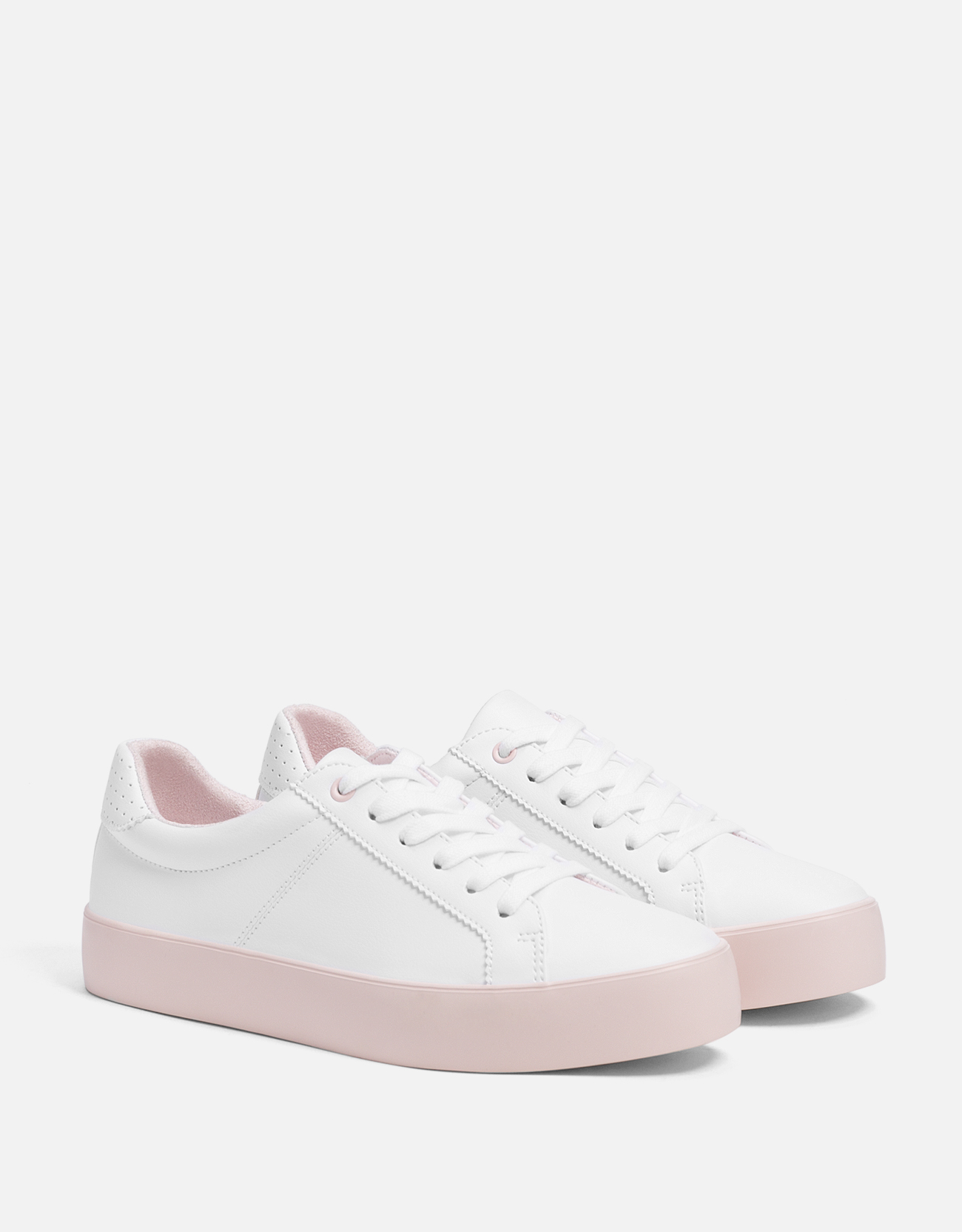 white sneakers with pink soles