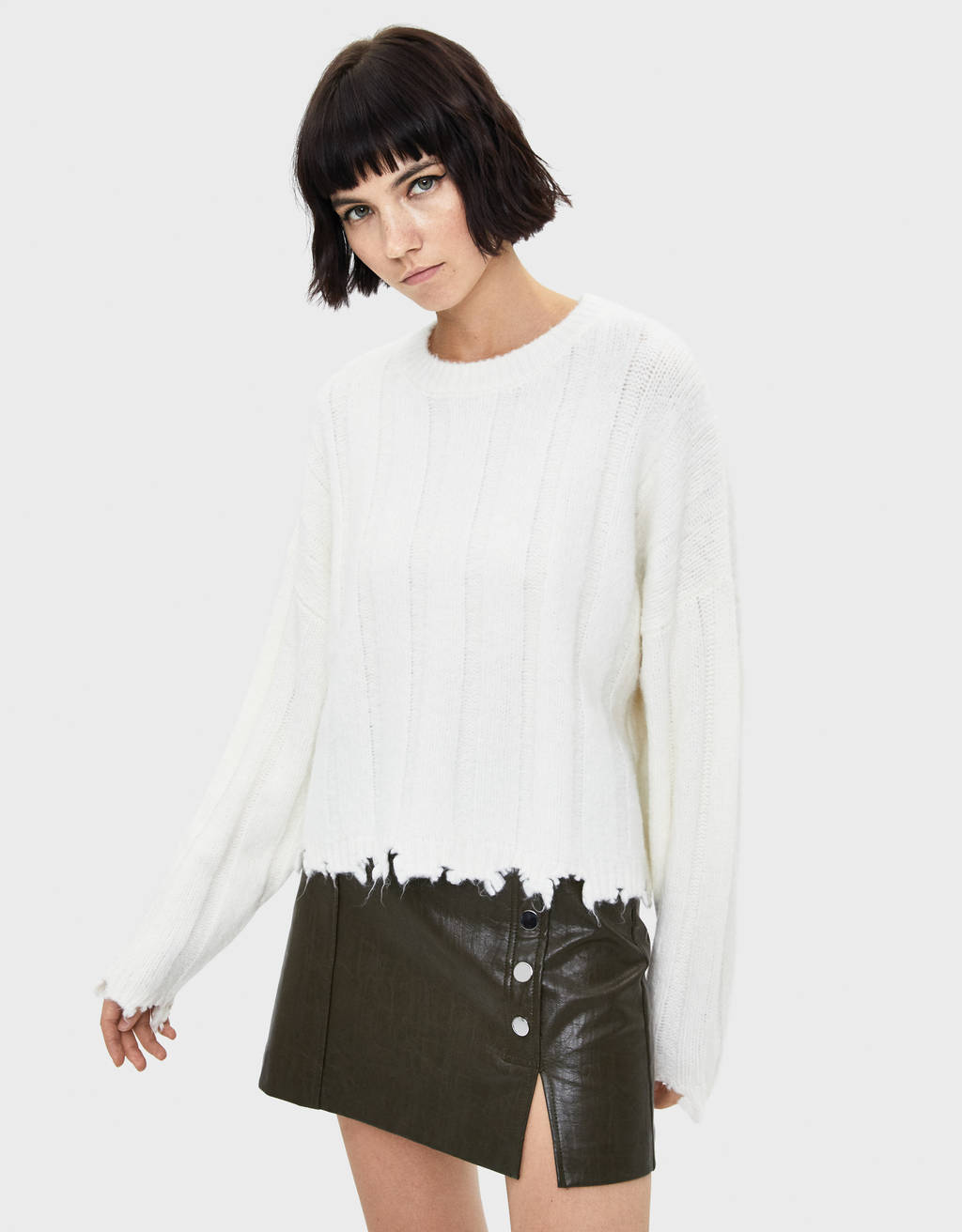 white ripped sweater