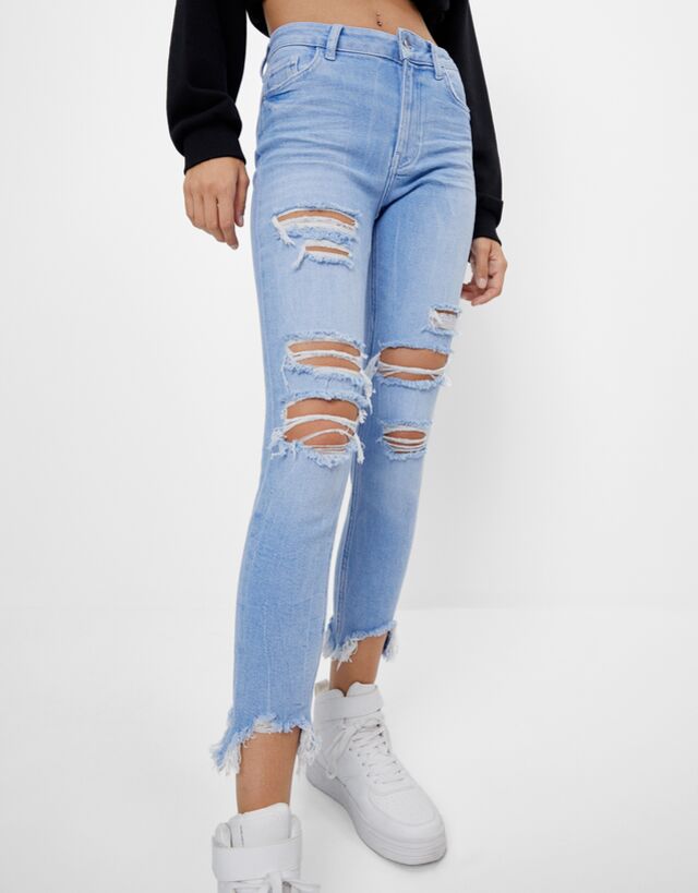 Mid-waist skinny jeans with rips 