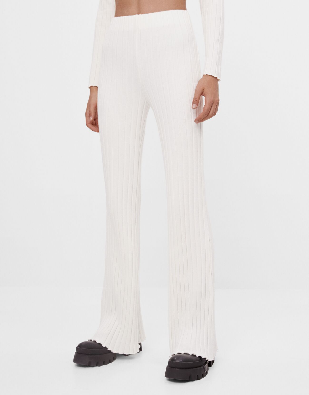 flared white trousers