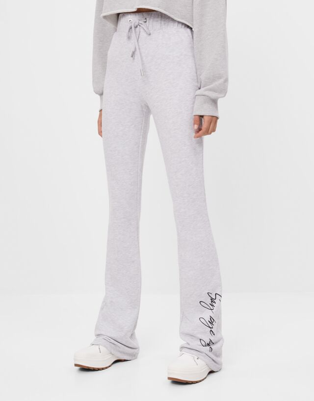Flared trousers with buckle - null 
