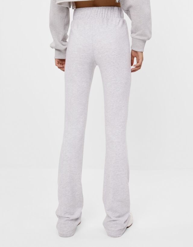 flared white trousers