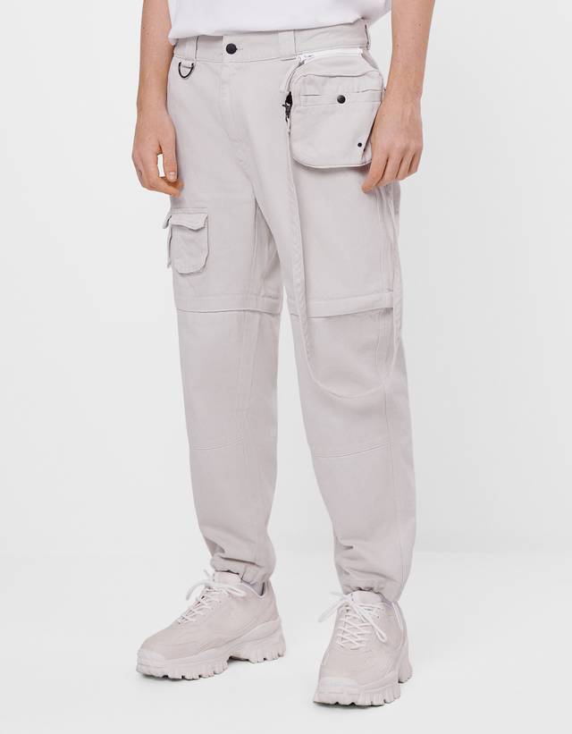 Denim trousers with detachable details 