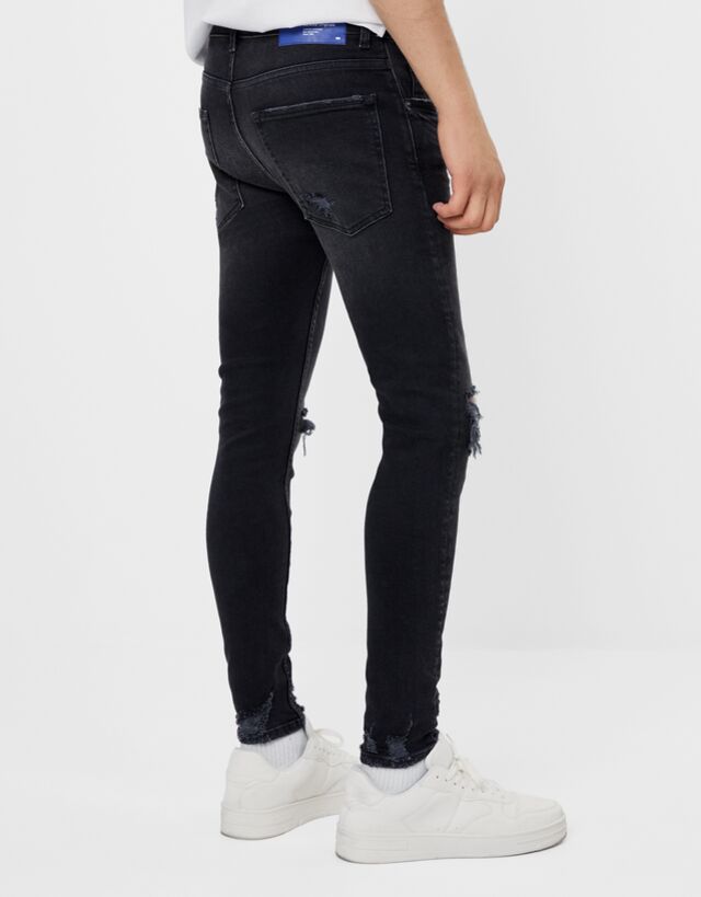 black super skinny ripped jeans