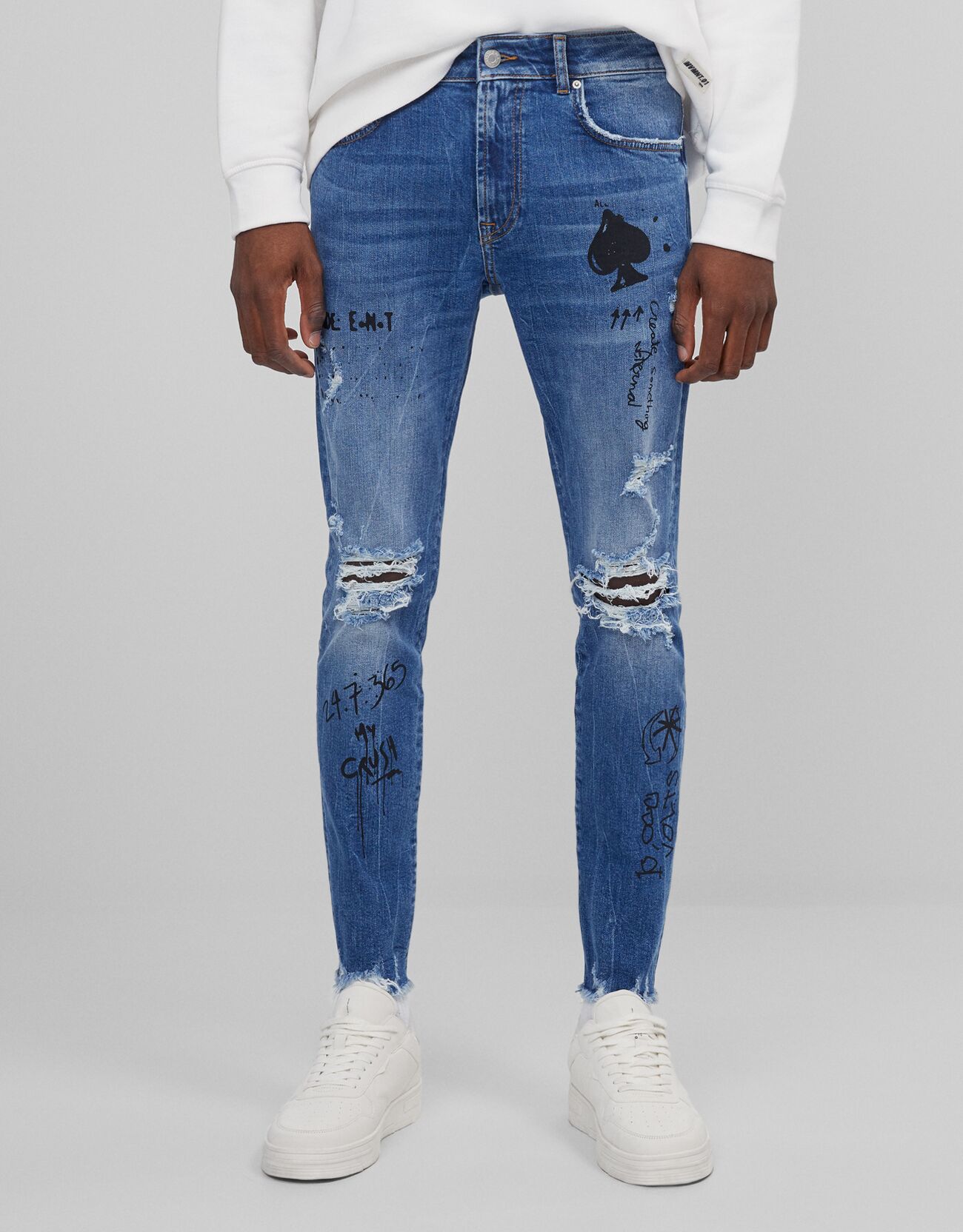 Graffiti skinny jeans with rips - Sale 