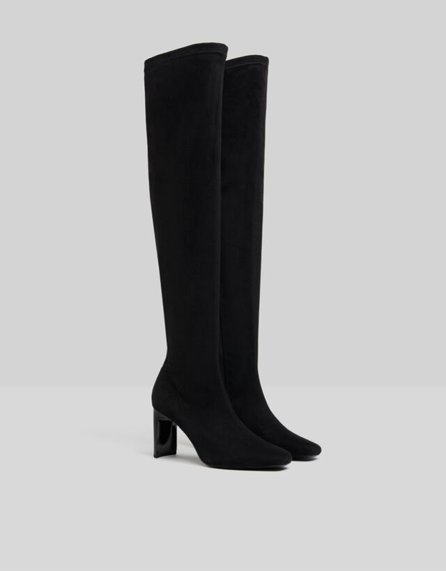 black fitted over the knee boots