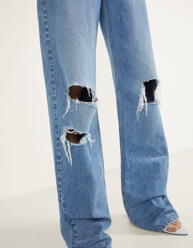 bershka 90's ripped flare jeans