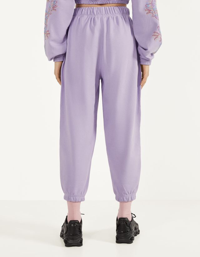 Jogging trousers with shiny dragon 