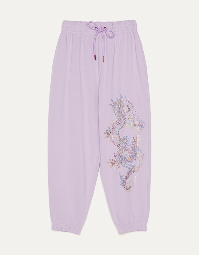 Jogging trousers with shiny dragon 
