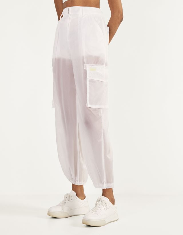 Transparent cargo trousers - Woman | Bershka