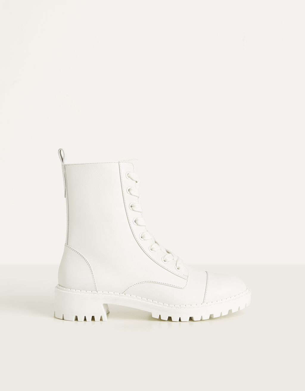 white leather flat ankle boots