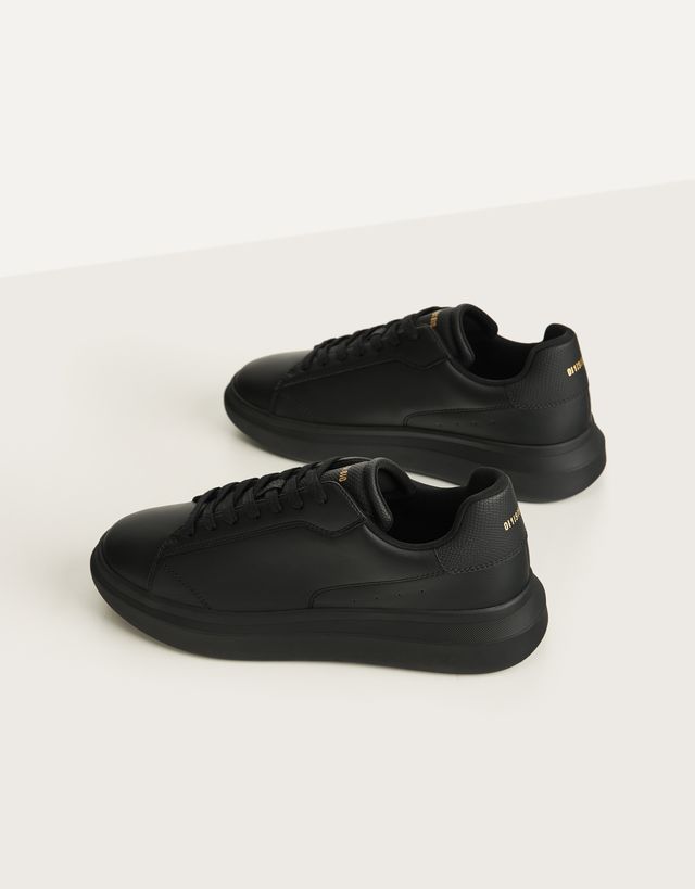 black trainers with white soles men's