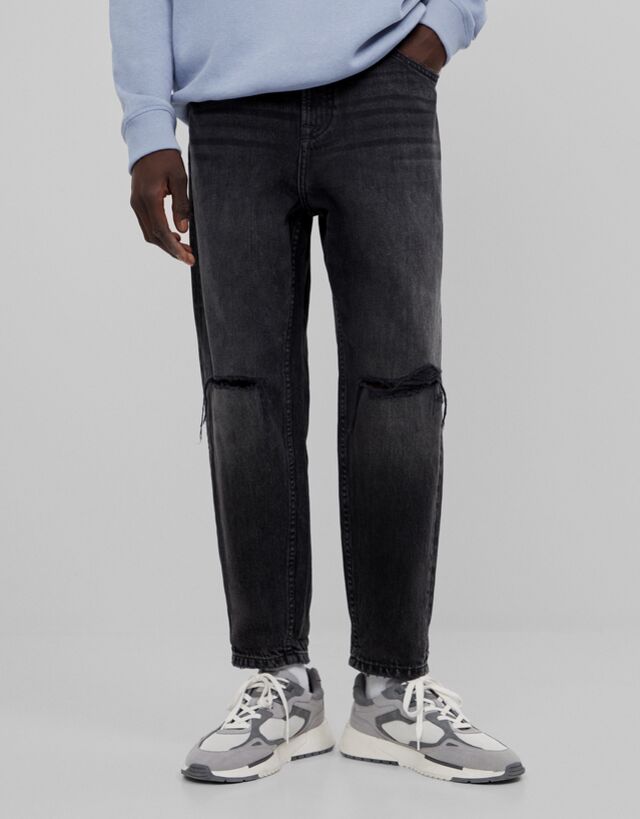 Loose fit jeans with rips - Jeans - Man 
