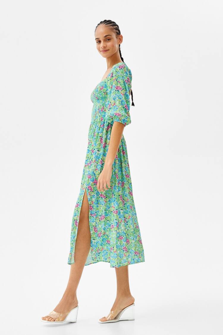 Long floral print dress with long sleeves and tied back