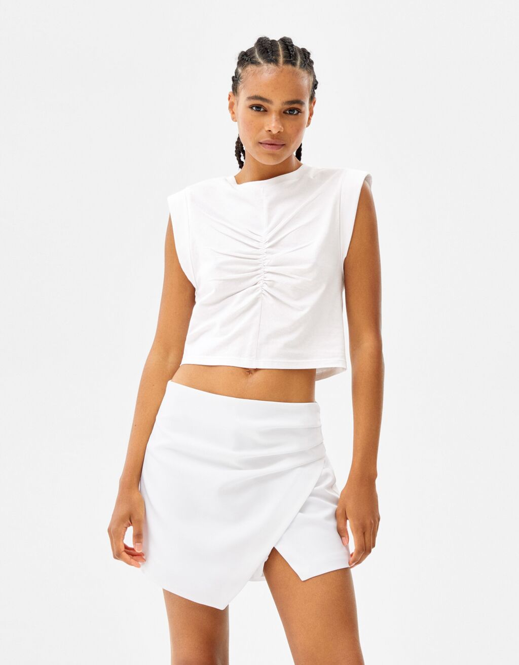 Sleeveless T-shirt with seam detail and front pleat