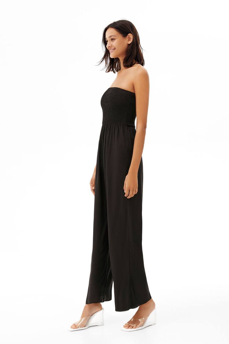 Long jumpsuit featuring a shirred elastic neckline