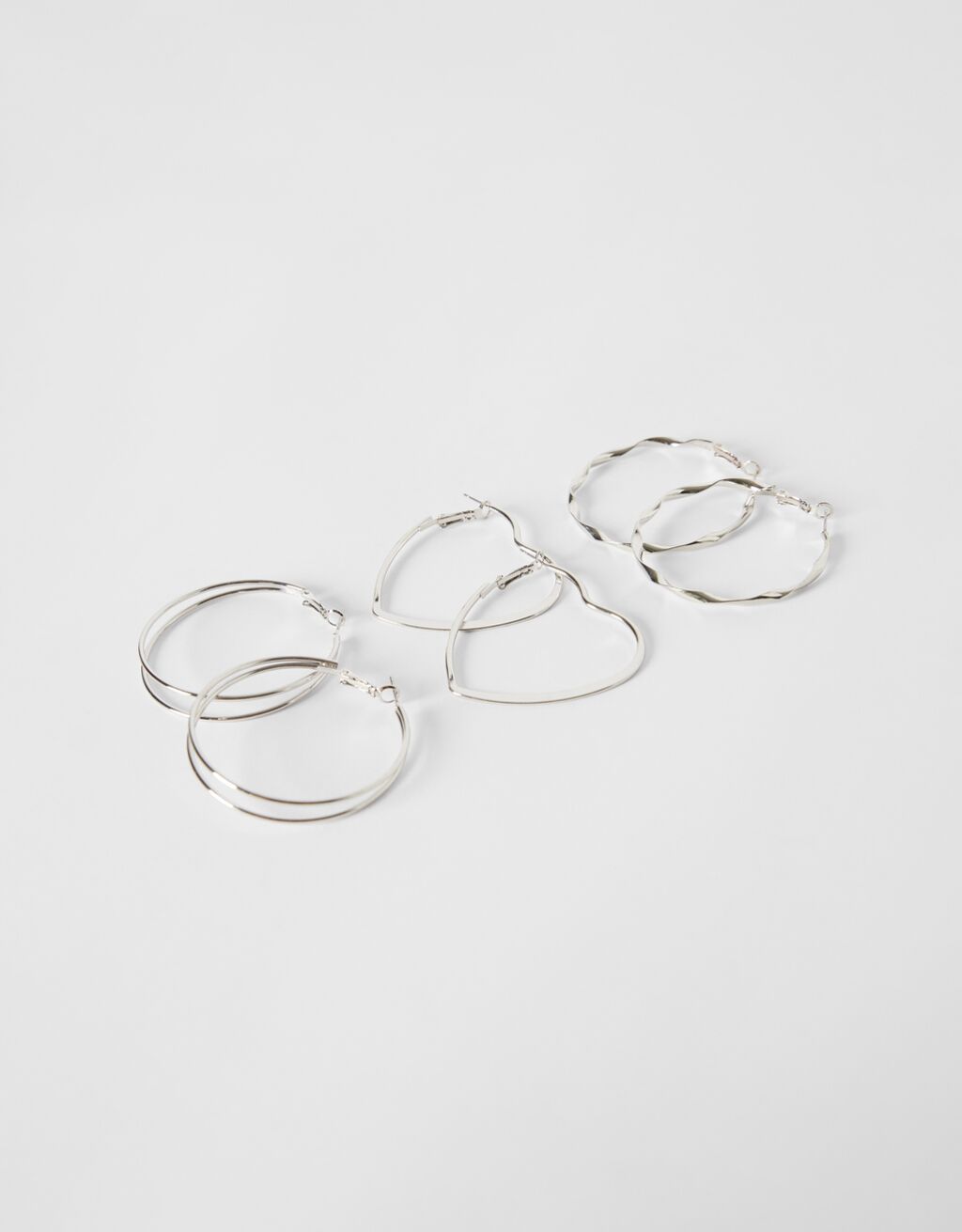 Set of 3 pairs of hoop earrings: thin hoops, textured and double heart
