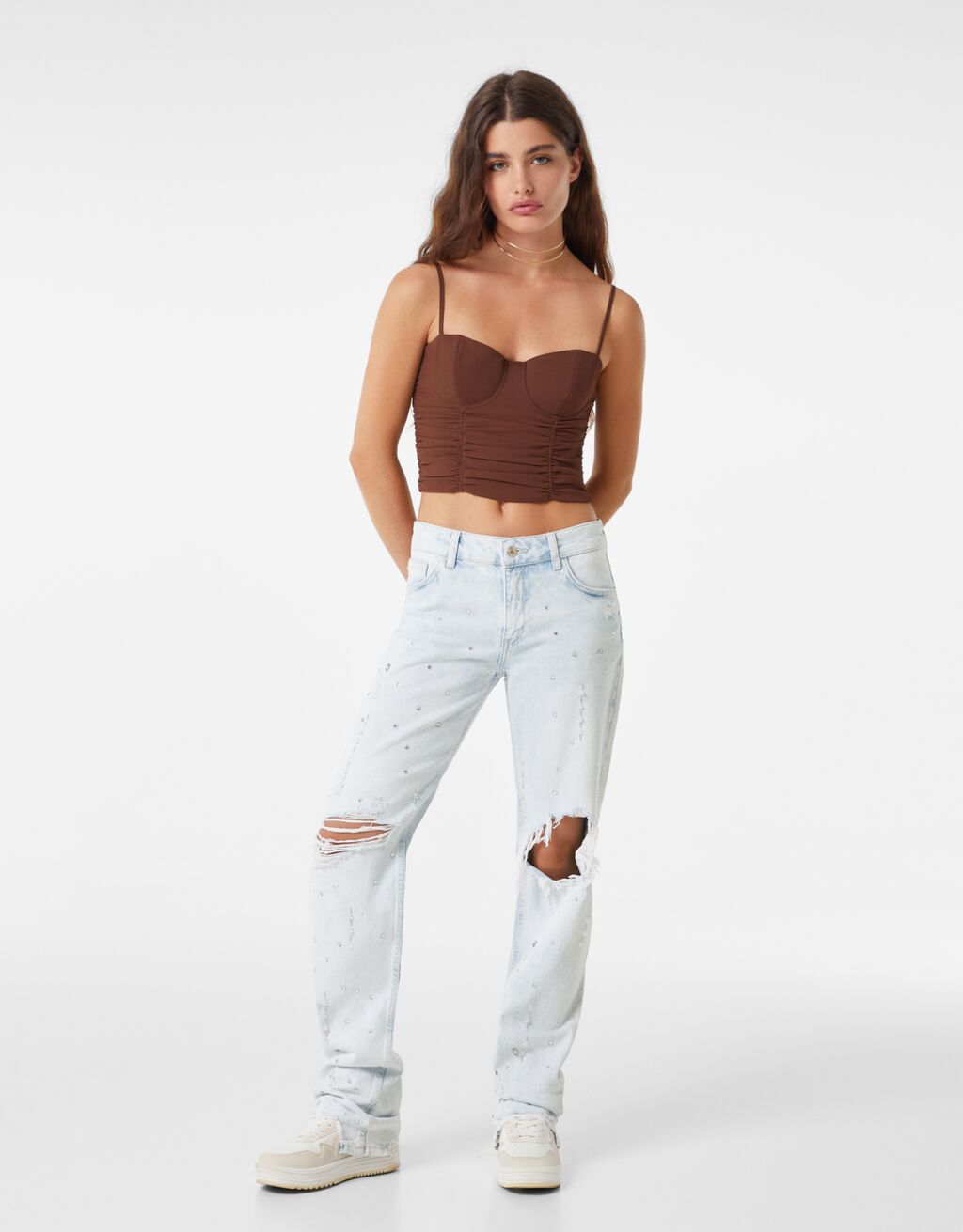 Straight fit jeans with rips and rhinestones