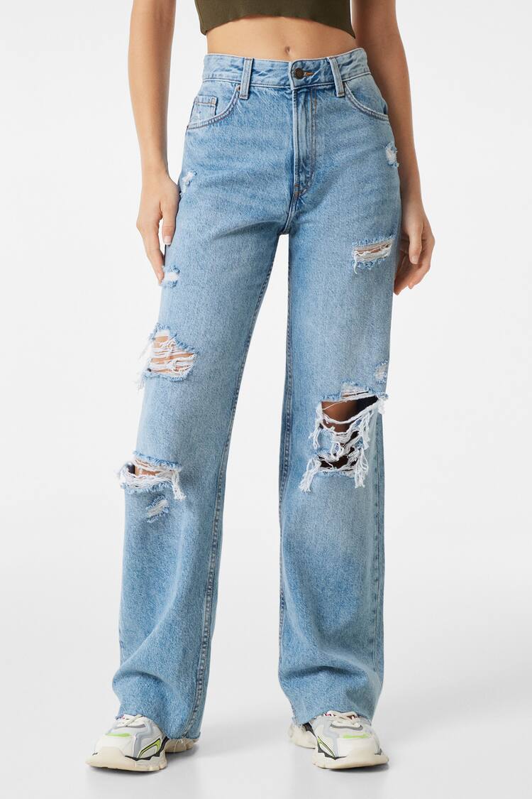Jeans gaya 90-an kaki lebar dengan robekan