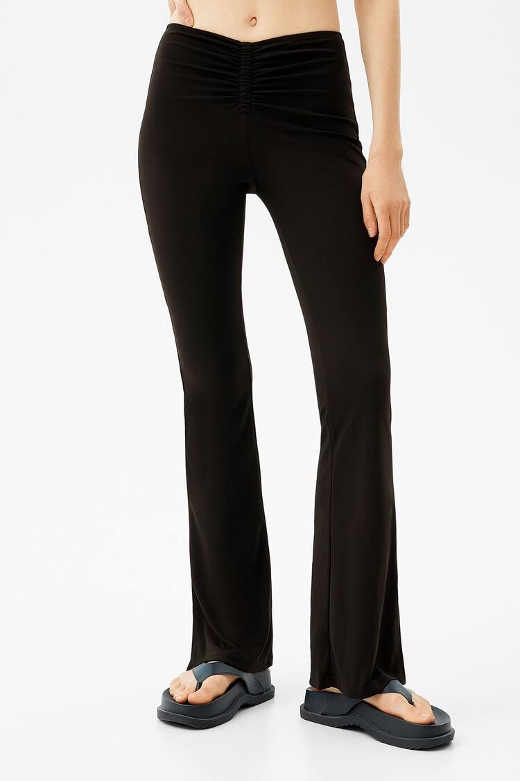 Flared trousers with ruched detail