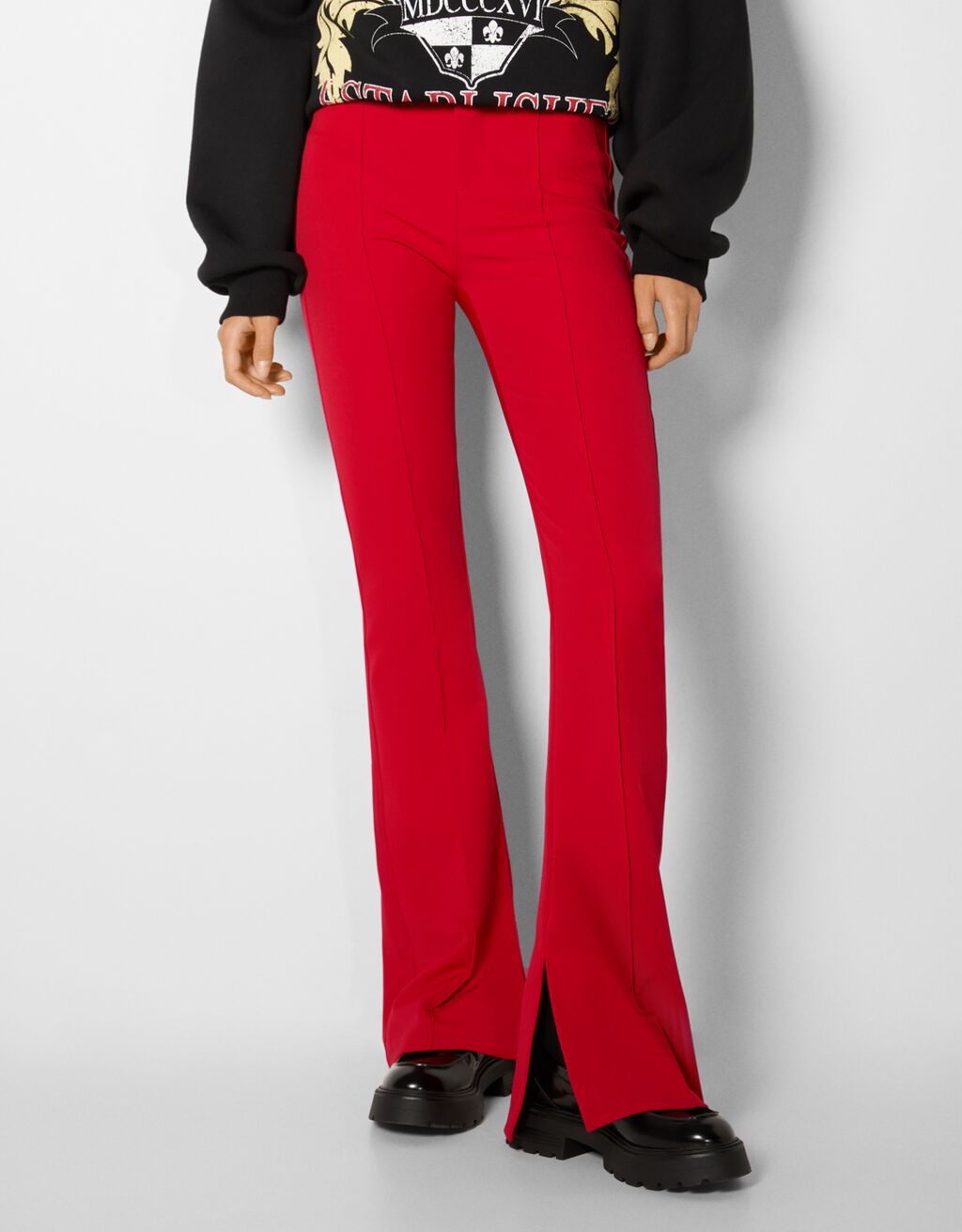 Fitted flared trousers with split hems