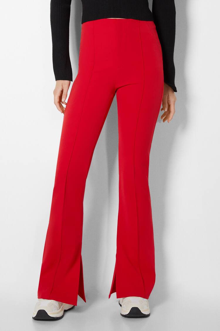Fitted flared trousers with split hems