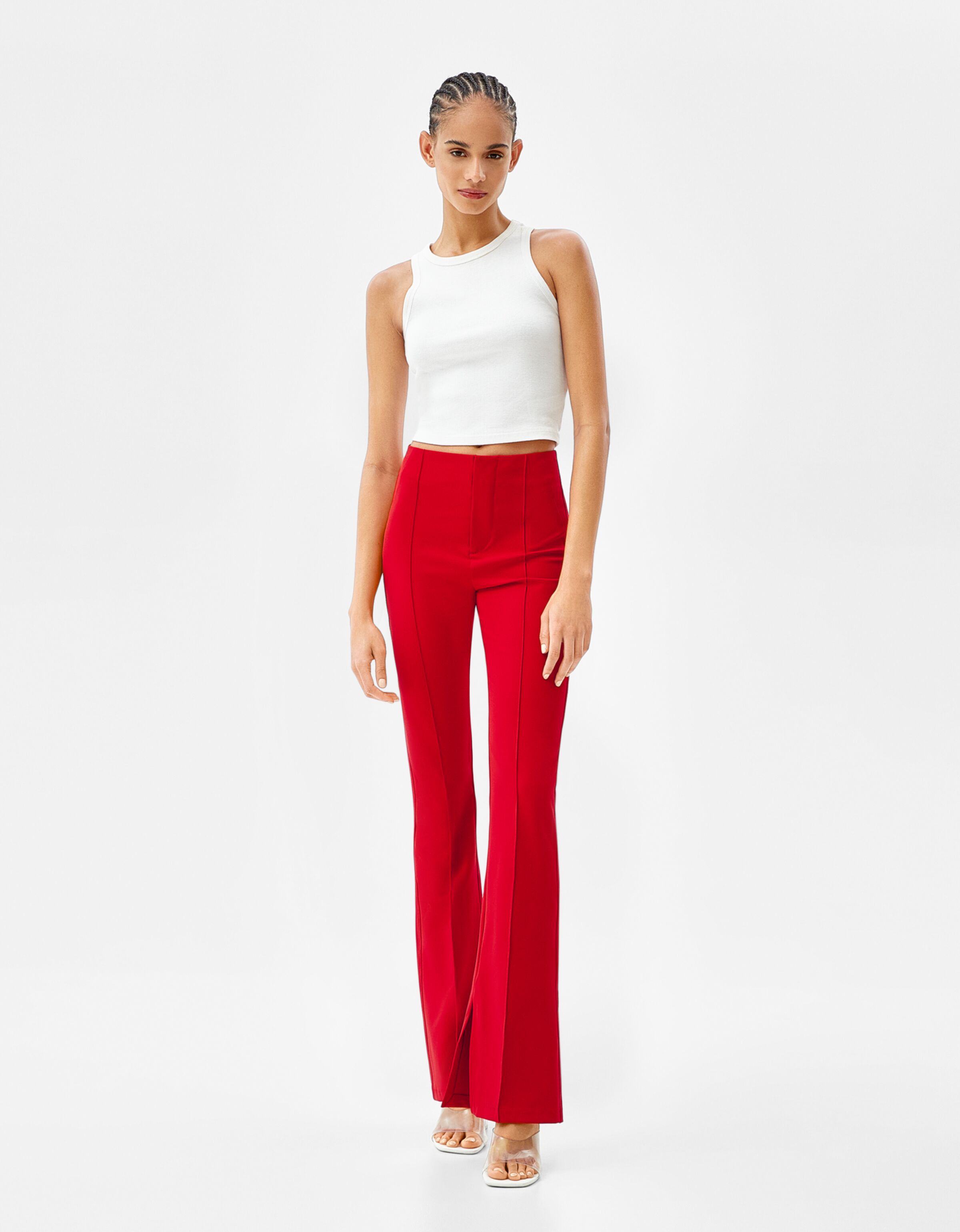 Fitted flared trousers with split hems 
