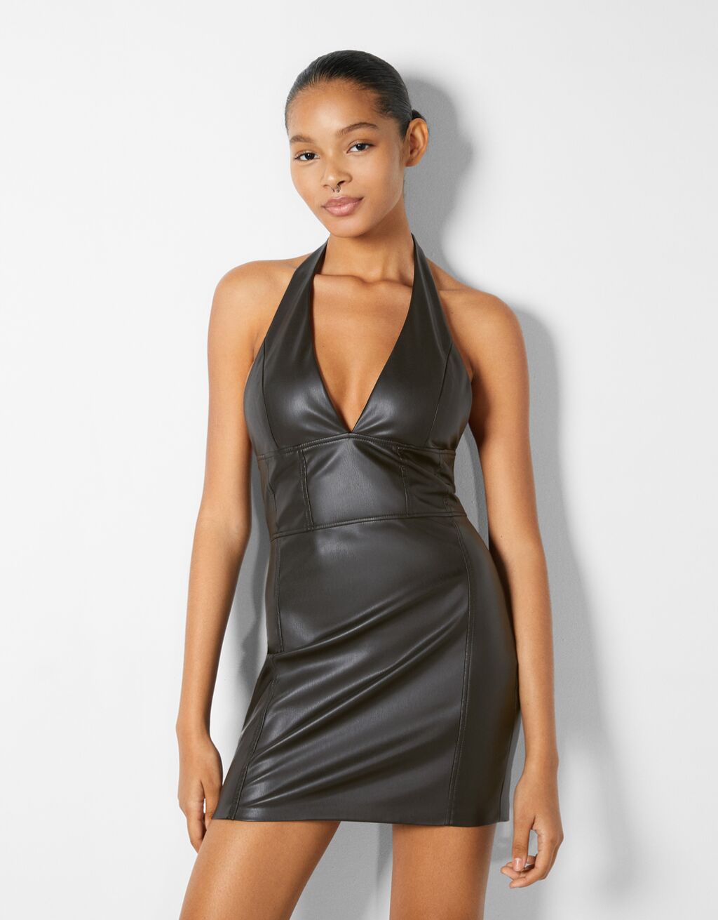 Faux leather mini dress with a halter neck and corset detail