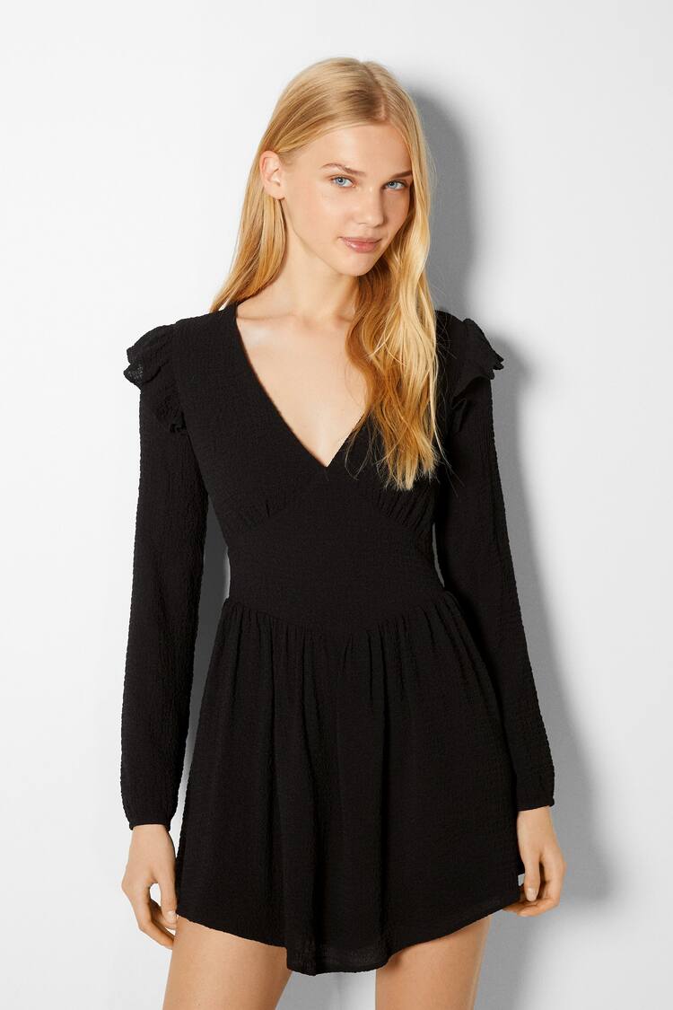 Waffle-knit mini dress with long sleeves and ruffles on the shoulders