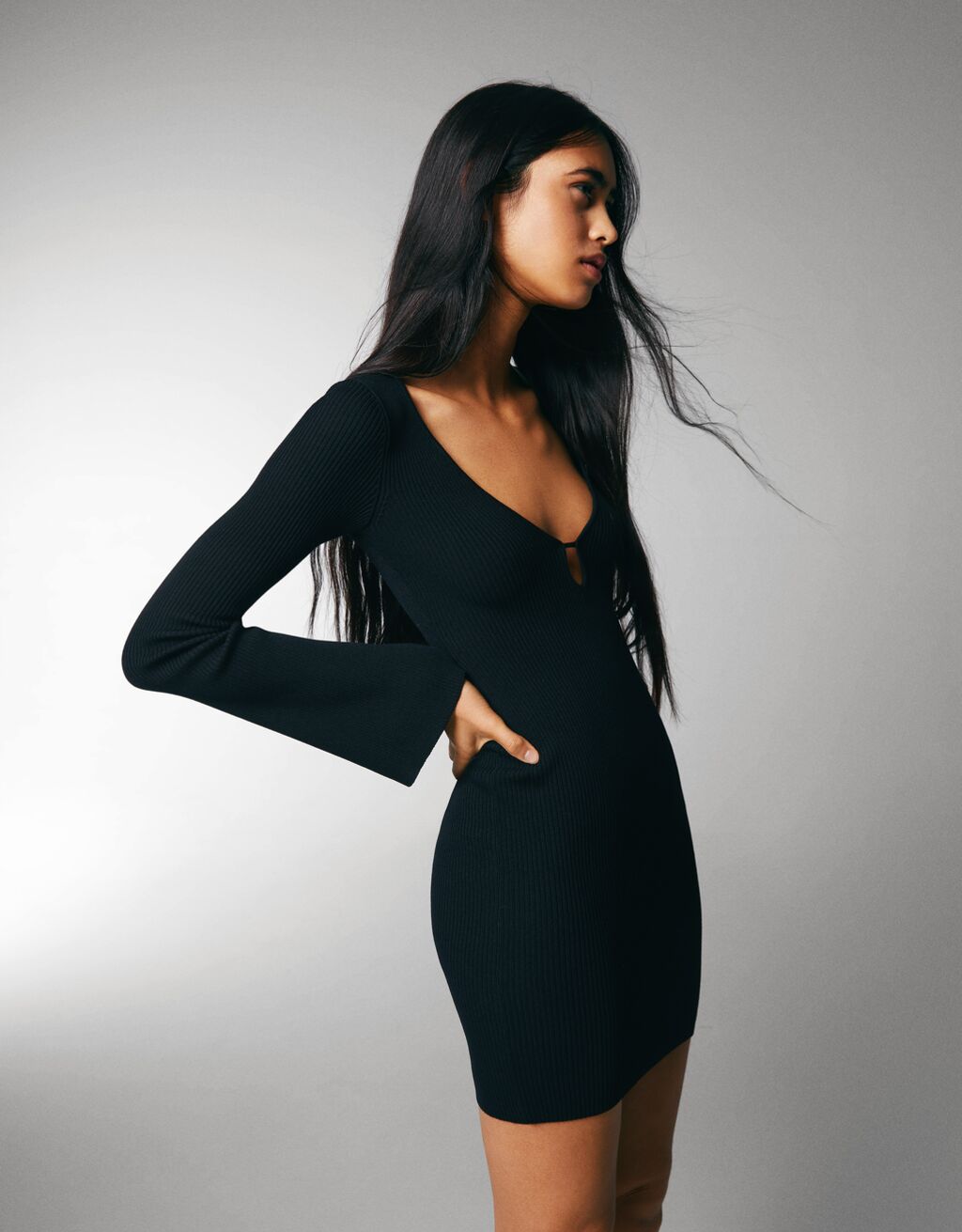 Long sleeve mini dress with a plunging neckline