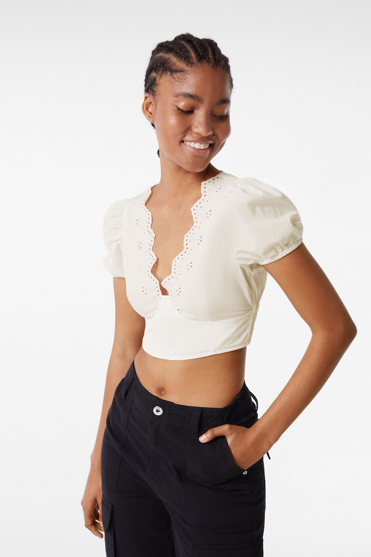 Corset blouse with Swiss embroidery on the neckline