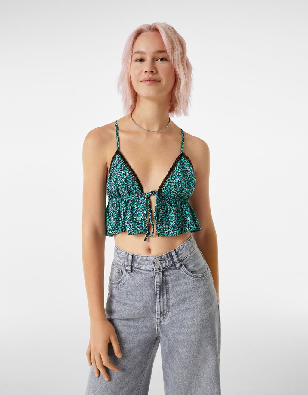 Crepe top with lace trim along the neckline