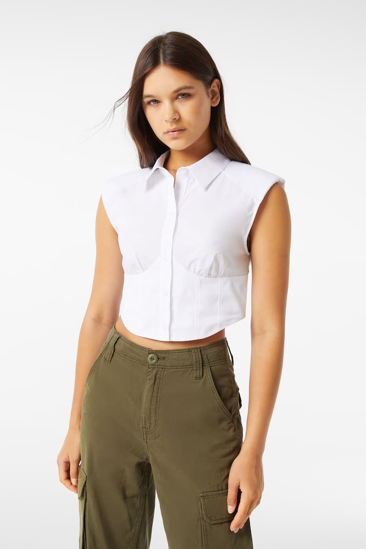 Sleeveless poplin corsetry-inspired shirt with shoulder pads