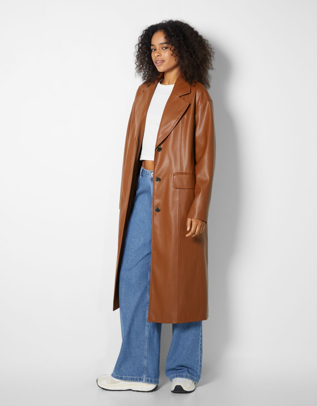 Faux leather long coat - Woman | Bershka