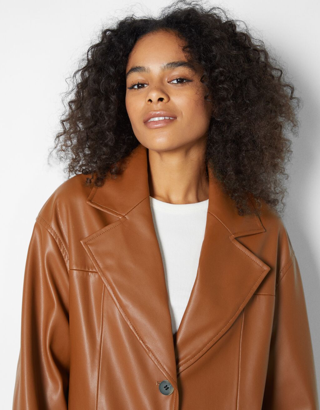 Faux leather long coat Woman Bershka