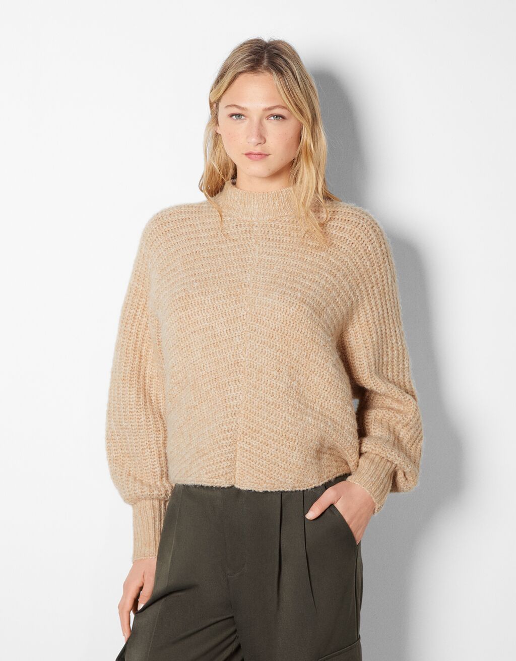 High neck sweater with wide sleeves and a ribbed seam
