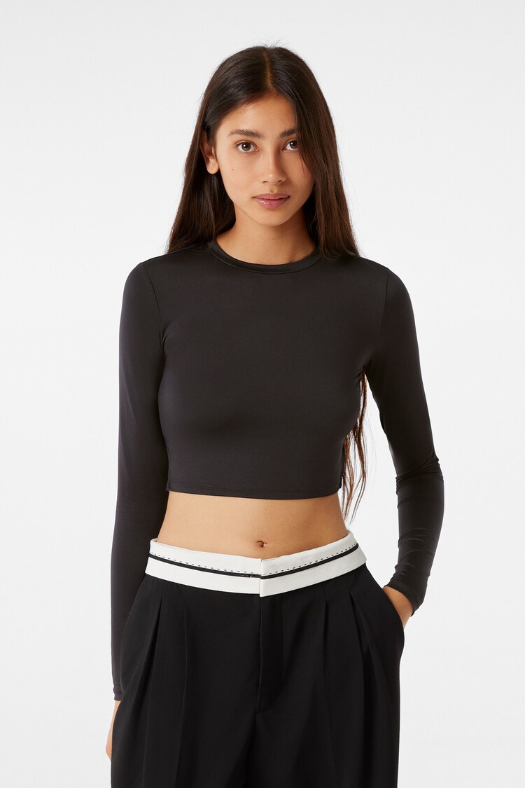 Long sleeve T-shirt with rings and straps at the back