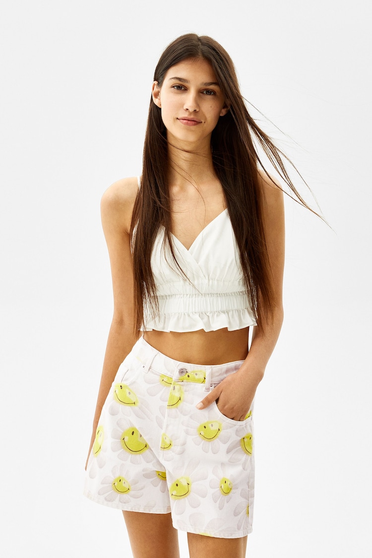 Denim shorts with Smiley® flower print