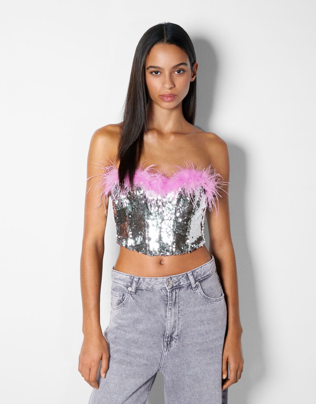 Sequinned top with feather detail