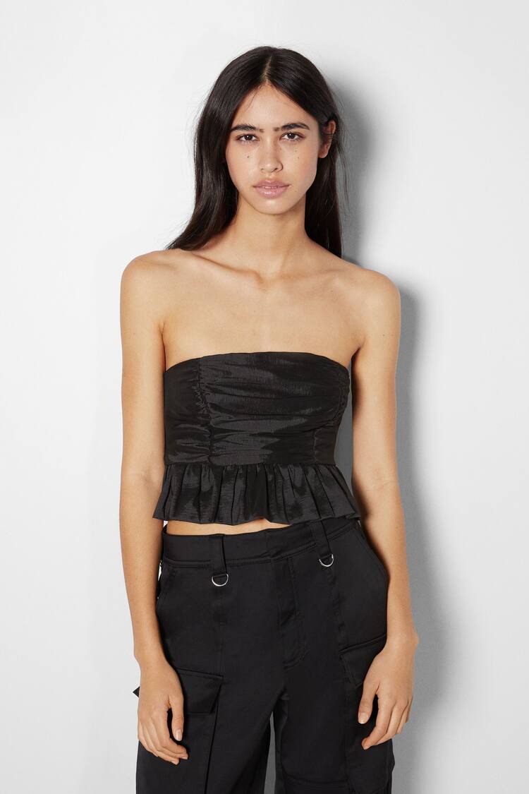 Sleeveless panelled top with peplum detail