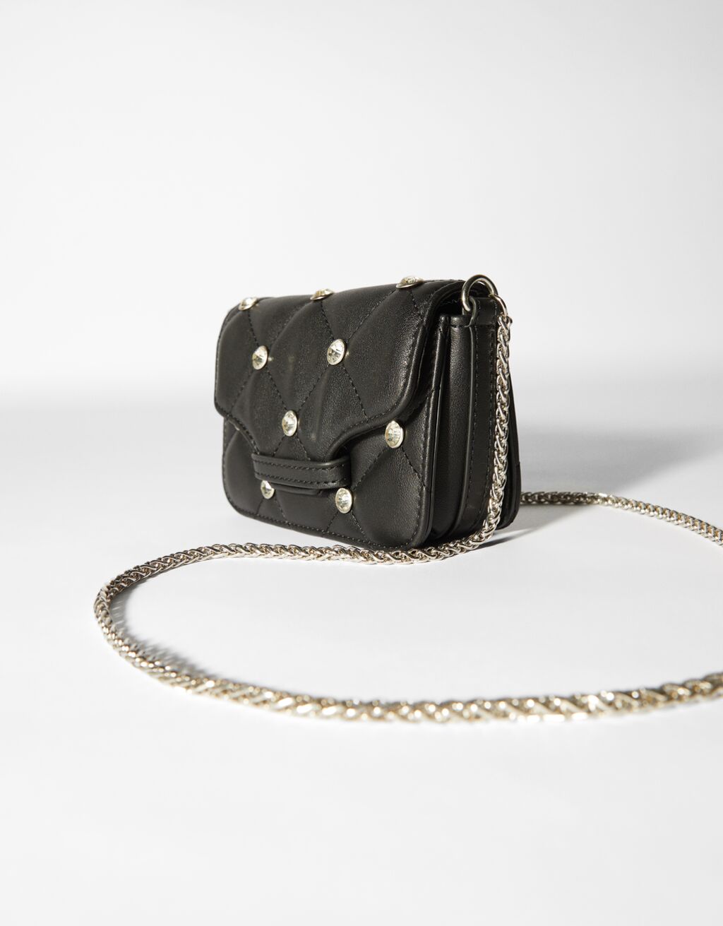 Mini faux leather quilted bag with chain and rhinestones Woman Bershka