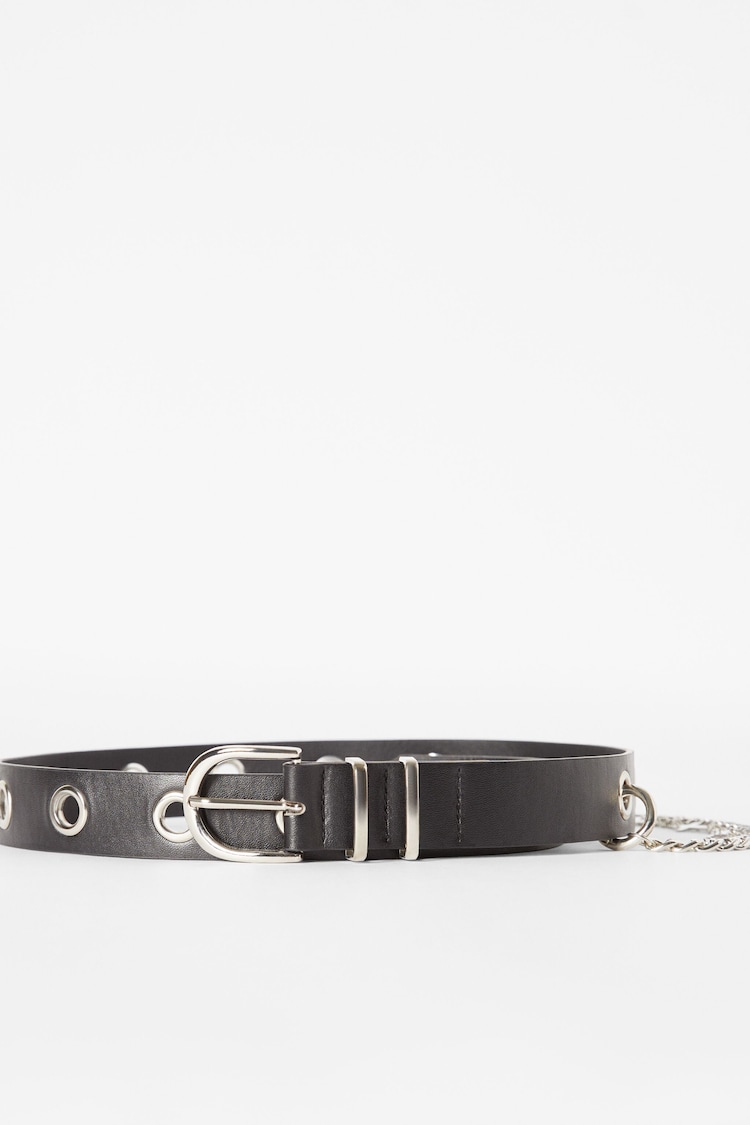 Belt with chain eyelets and cross