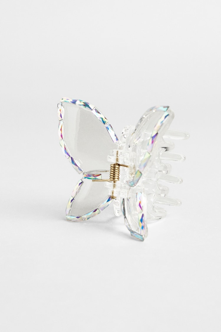 Transparent hårspänne i form av fjäril med strass