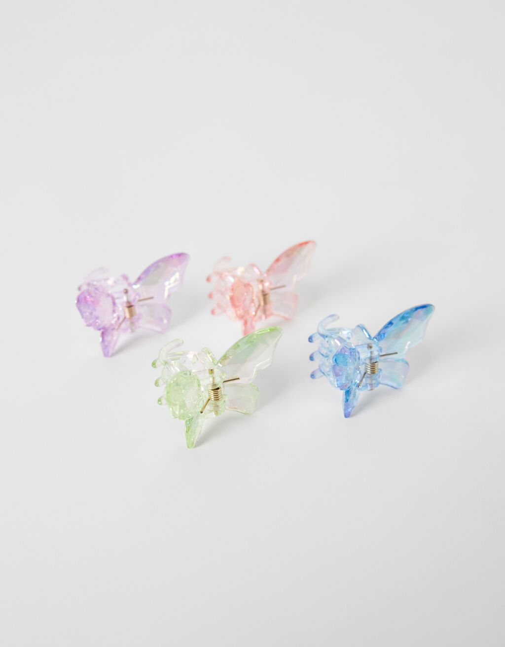 Set met 4 haarclips met gekleurde vlinders