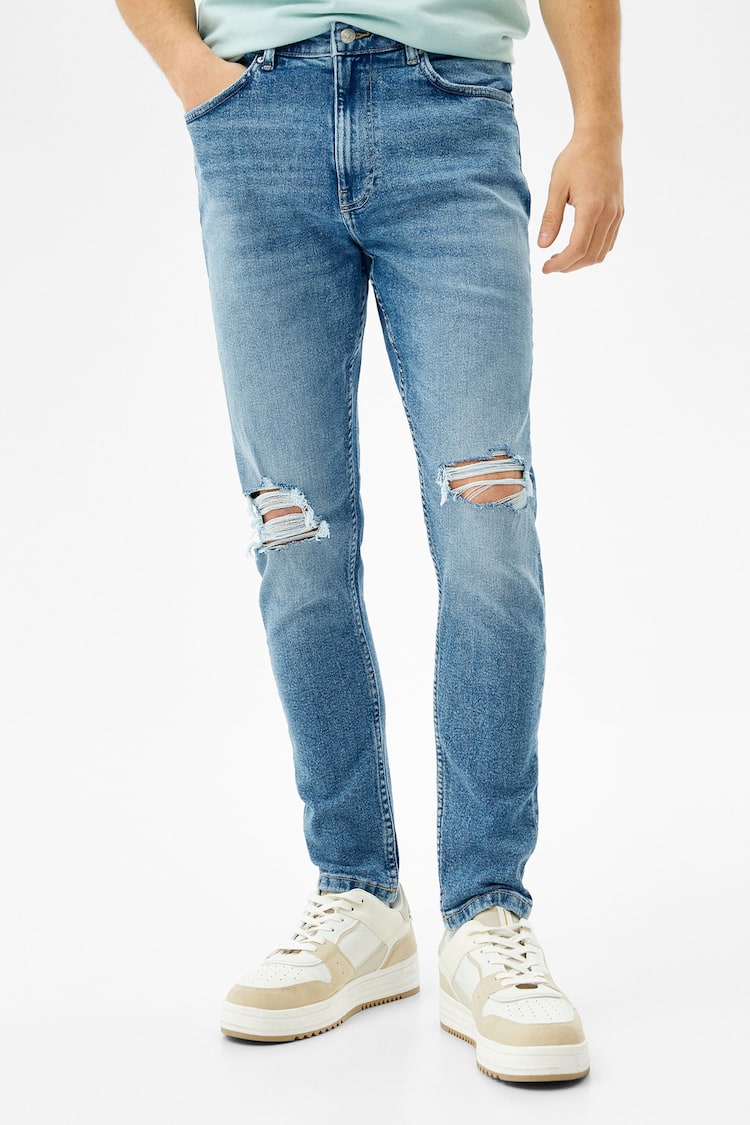 Jeans carrot com rasgões
