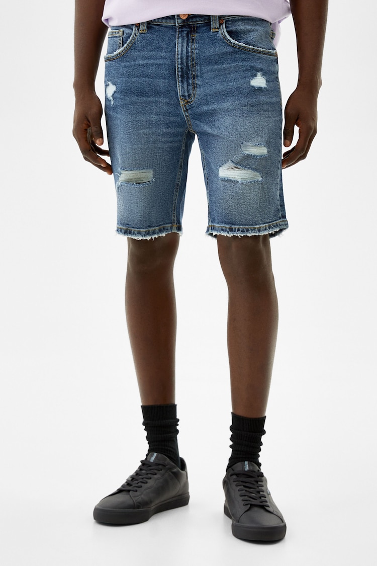Skinny denim Bermuda shorts with rips