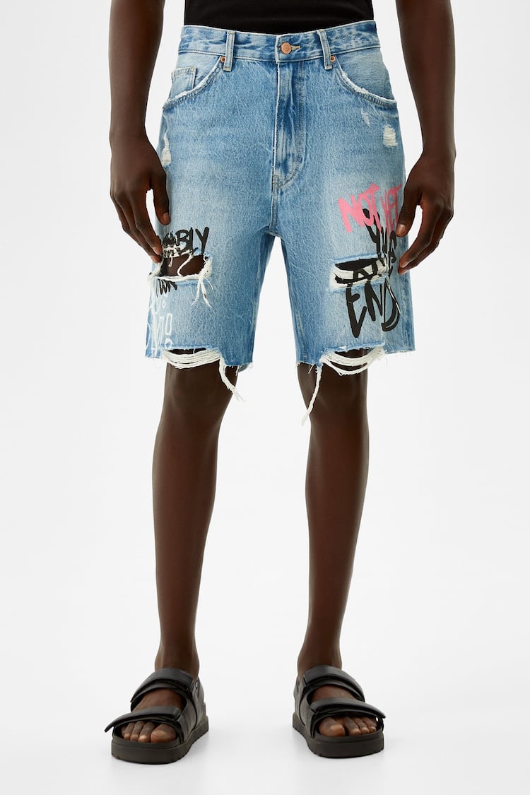 Printed ripped denim Bermuda shorts