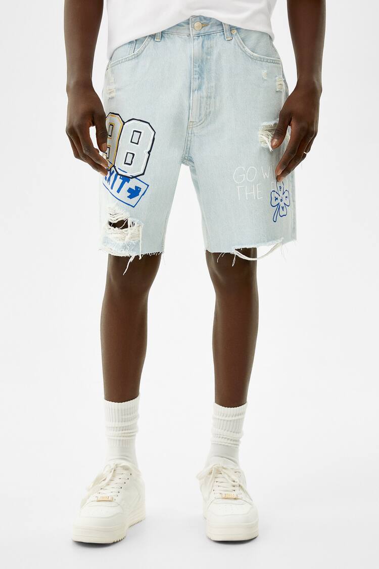 Printed ripped denim Bermuda shorts