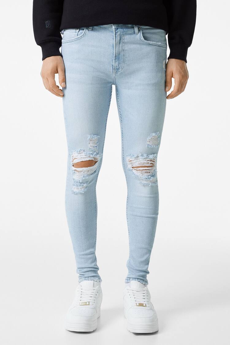 Jeans super skinny fit com rasgões