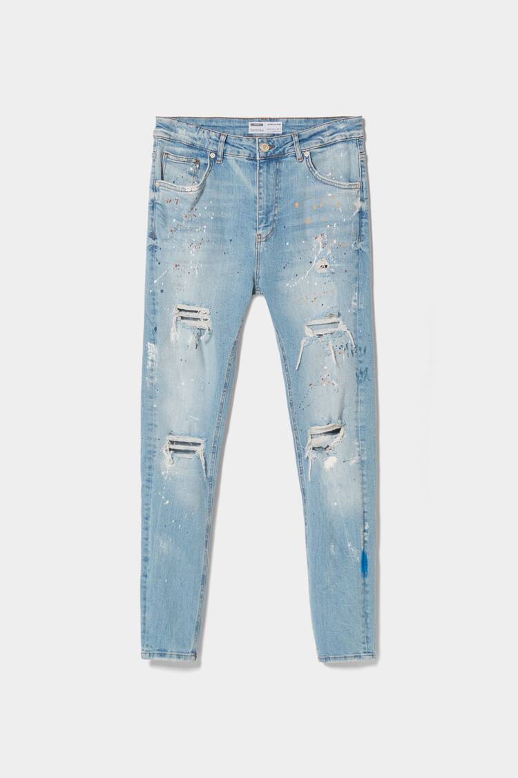 Ripped paint splatter skinny jeans